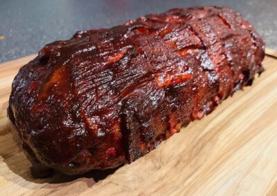 Smoked Love Meatloaf resting on a cutting board